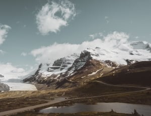 snow covered mountain during cloudy sky thumbnail