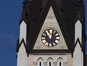 white and brown clock tower thumbnail