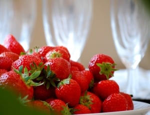 red strawberries on white ceramic plate thumbnail