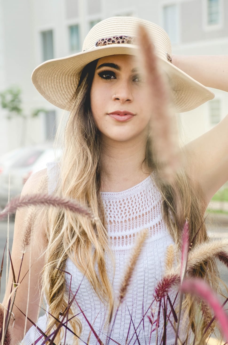 women's brown sun hat and whit sleeveless top preview