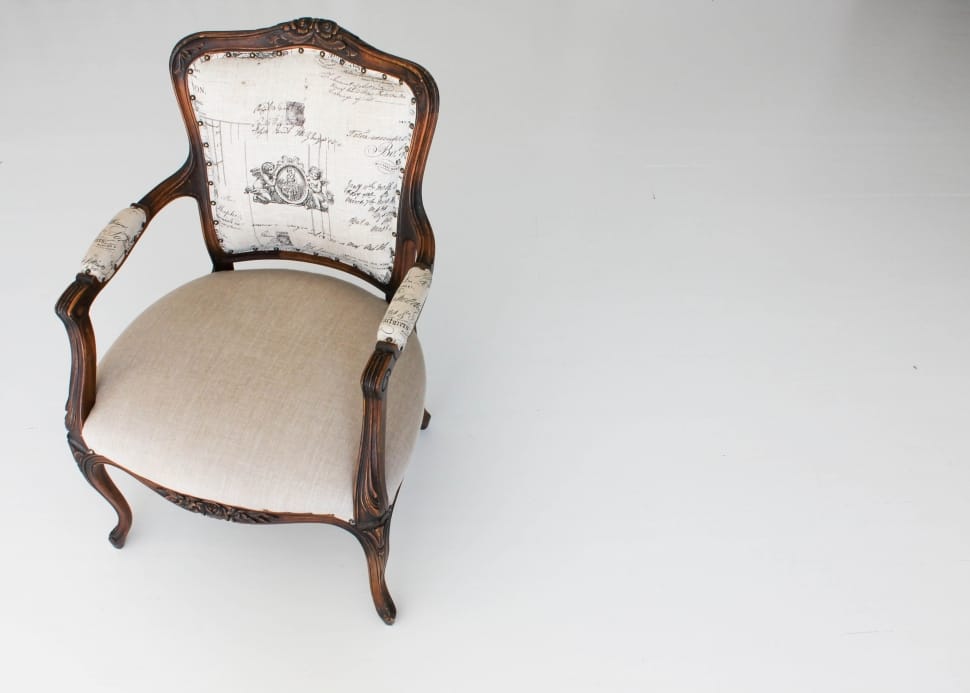 brown wooden framed white padded armchair preview