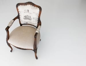 brown wooden framed white padded armchair thumbnail