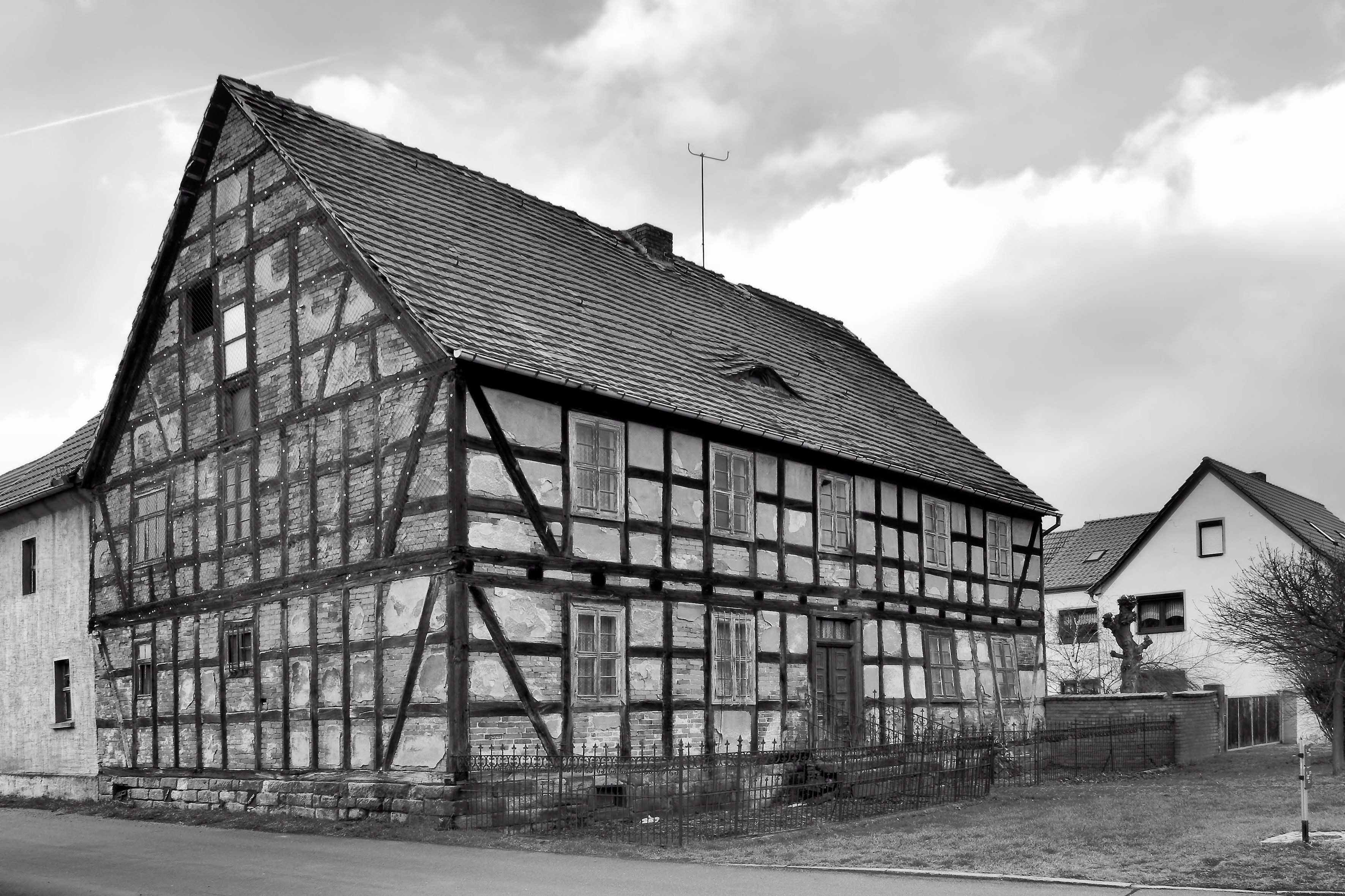 grayscale photo of barn house