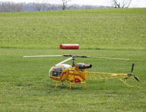 yellow remote controlled helicopter thumbnail