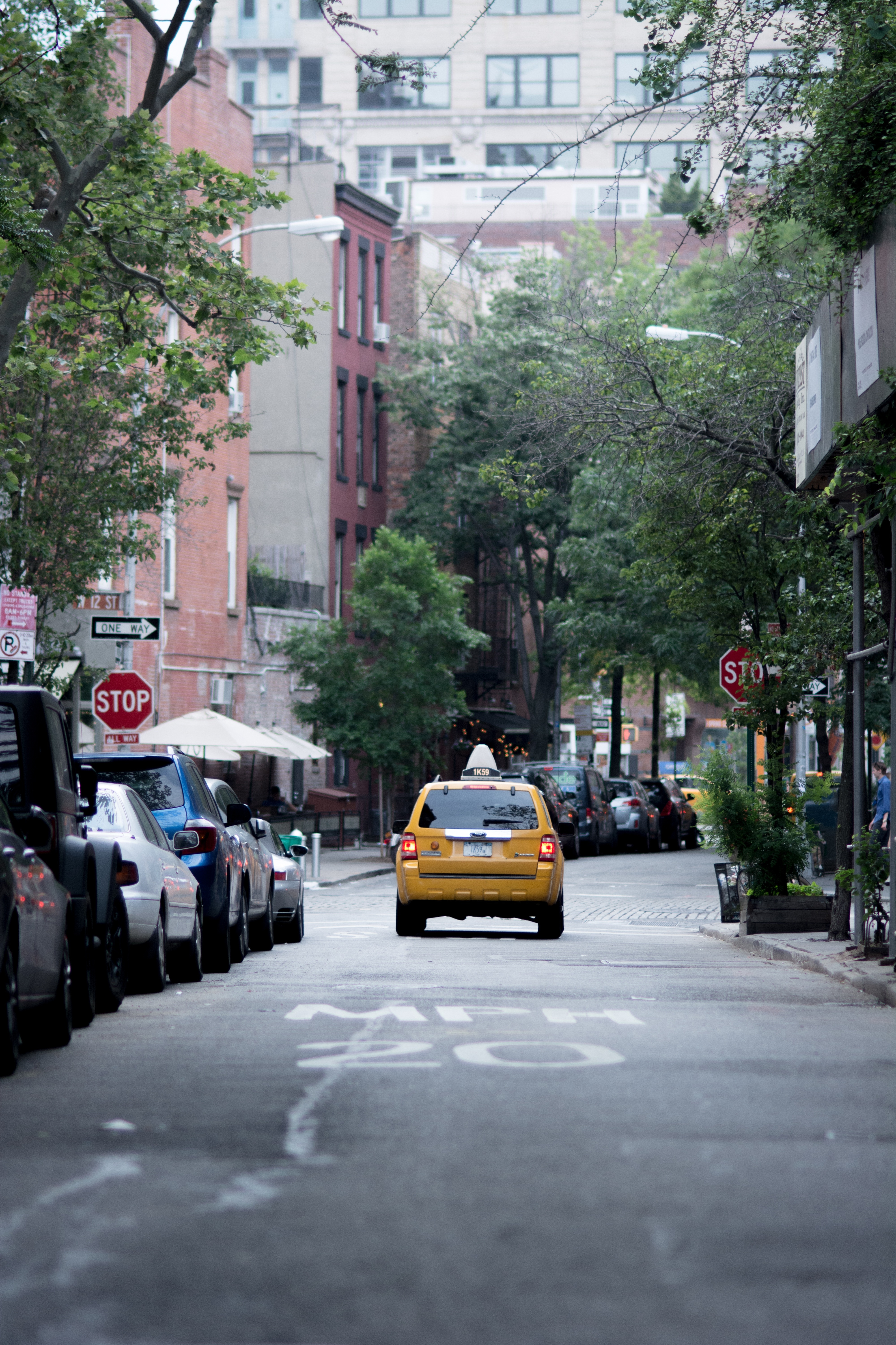 Yellow Taxi Cab on City Streets
