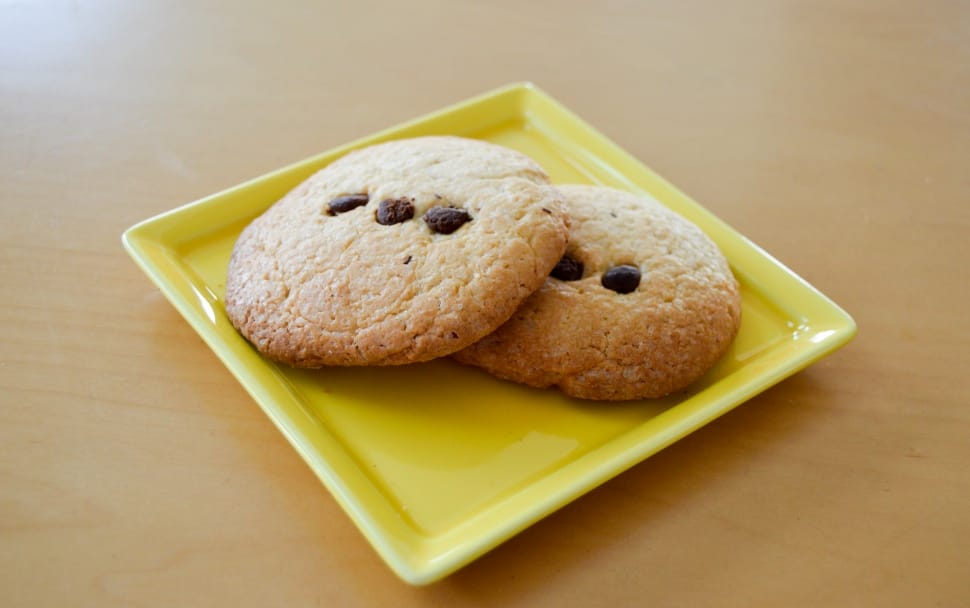 two cookies on square yellow ceramic plate preview