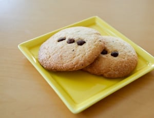 two cookies on square yellow ceramic plate thumbnail