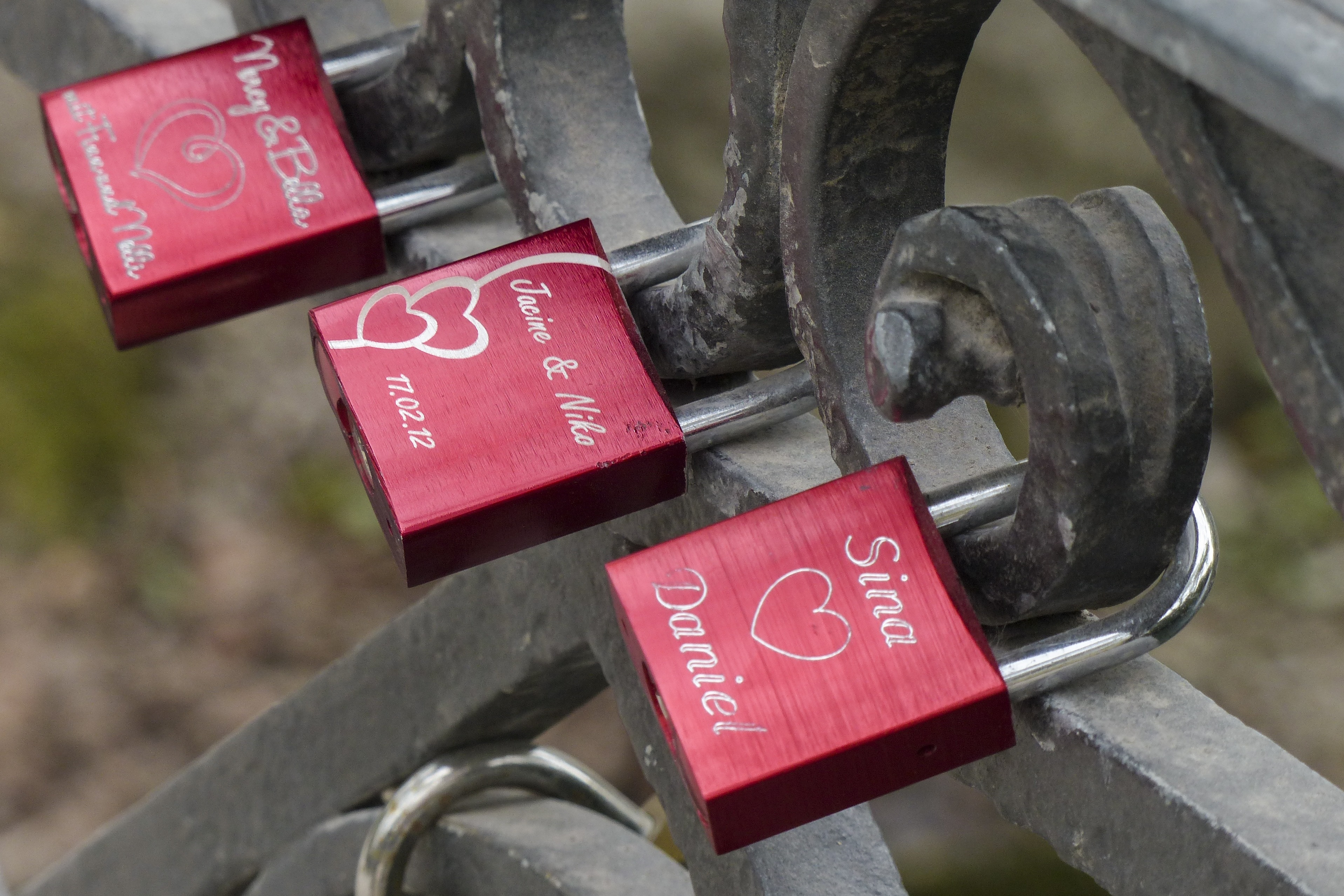 3 red and silver padlocks