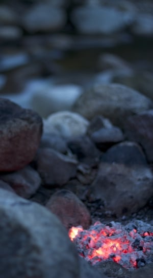 shallow focus photography of burning charcoal near body of water thumbnail
