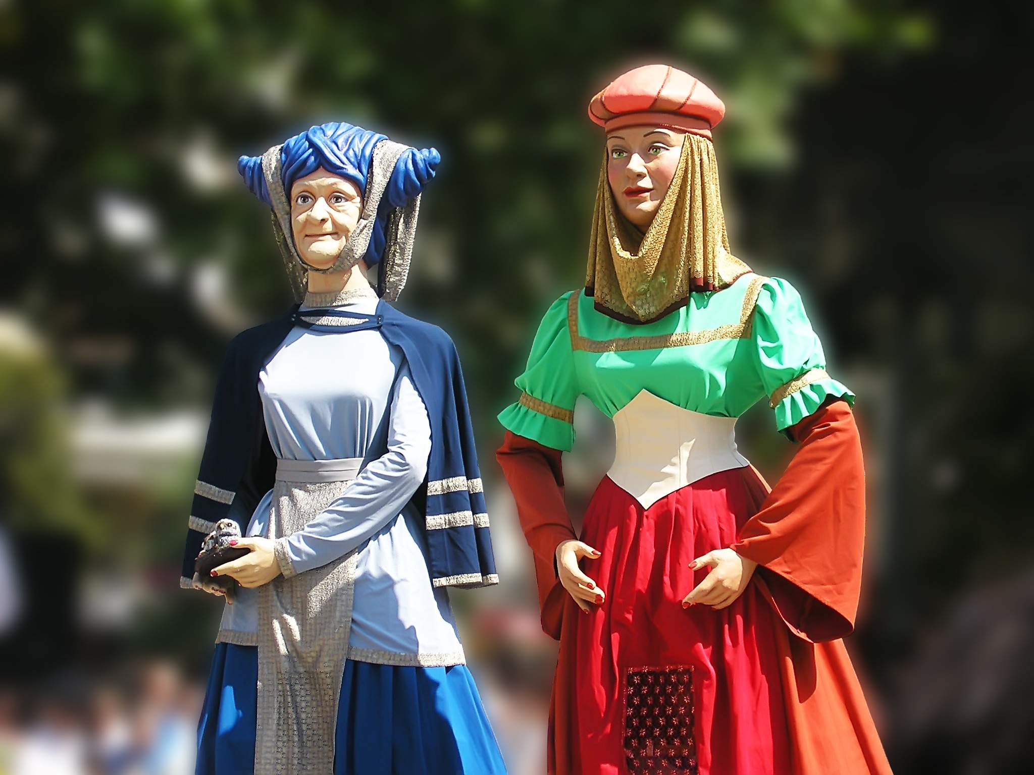 2 women standing wearing dresses statues set
