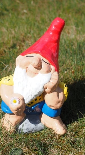 elf in red hat ceramic figurine thumbnail