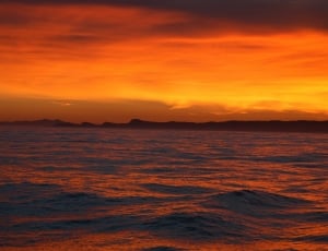 photo of ocean during sunset thumbnail