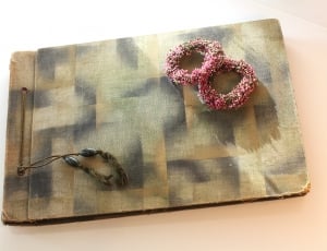 grey and beige plaid covered book thumbnail