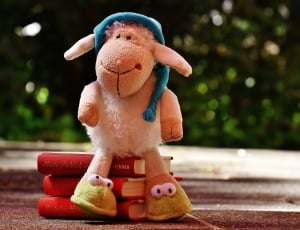 plush pink lamb with blue hat thumbnail