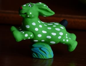 green and white rabbit figurine thumbnail