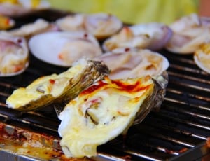 oyster grilled with cheese shallow focus thumbnail