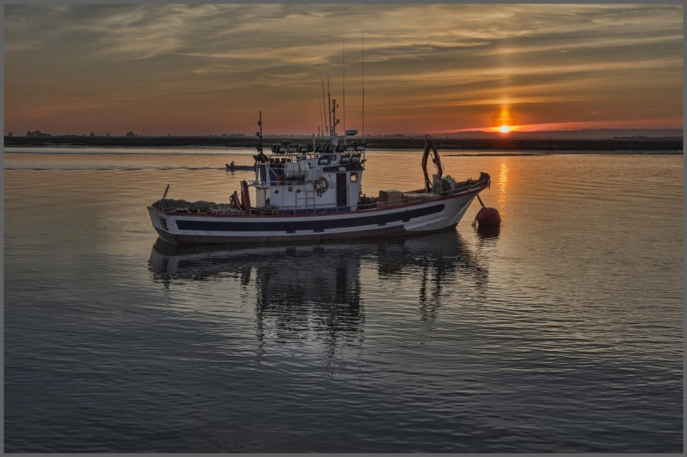 tug boat in the middle of body of water during daylight preview