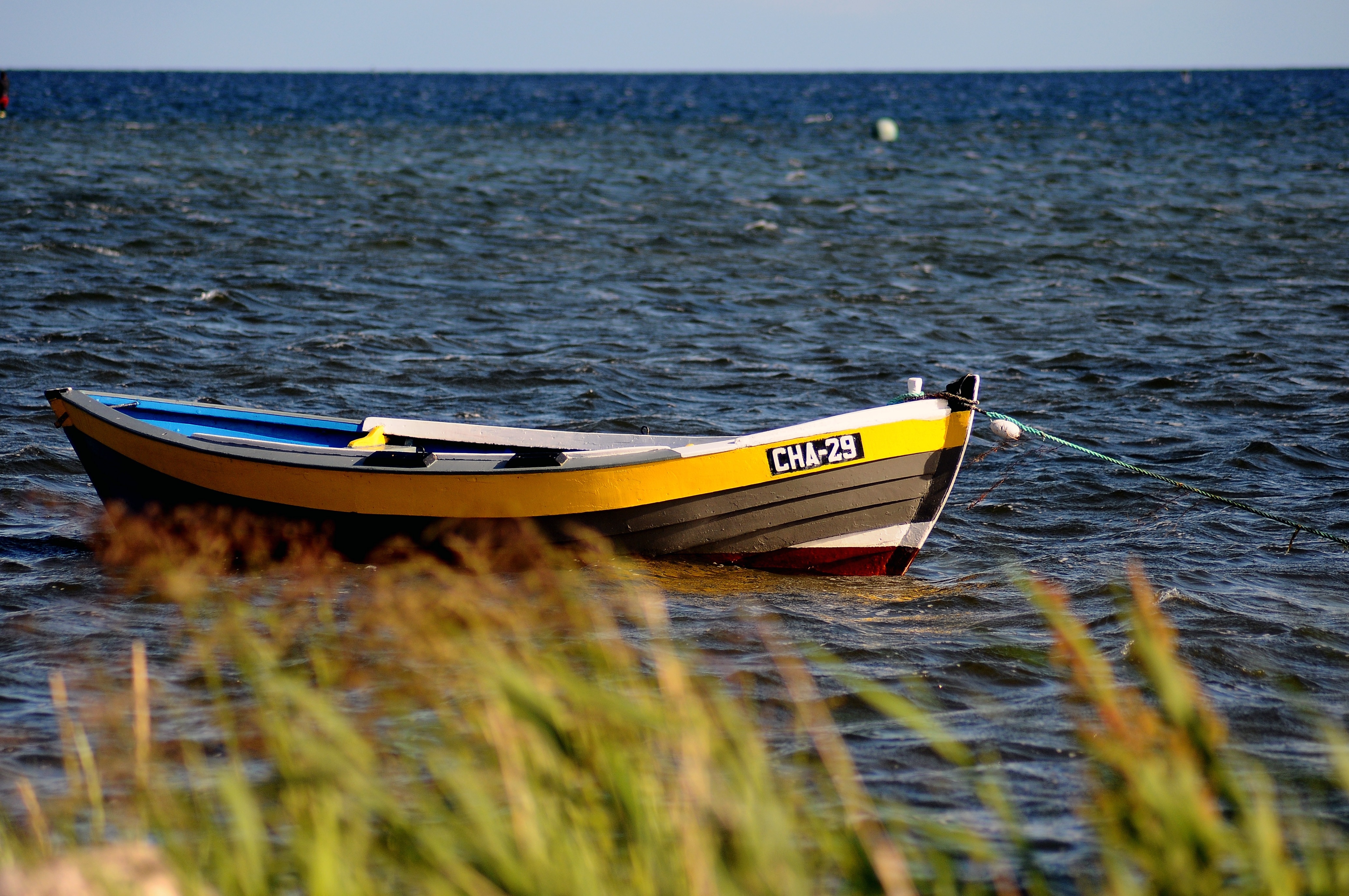 white and yellow canoe