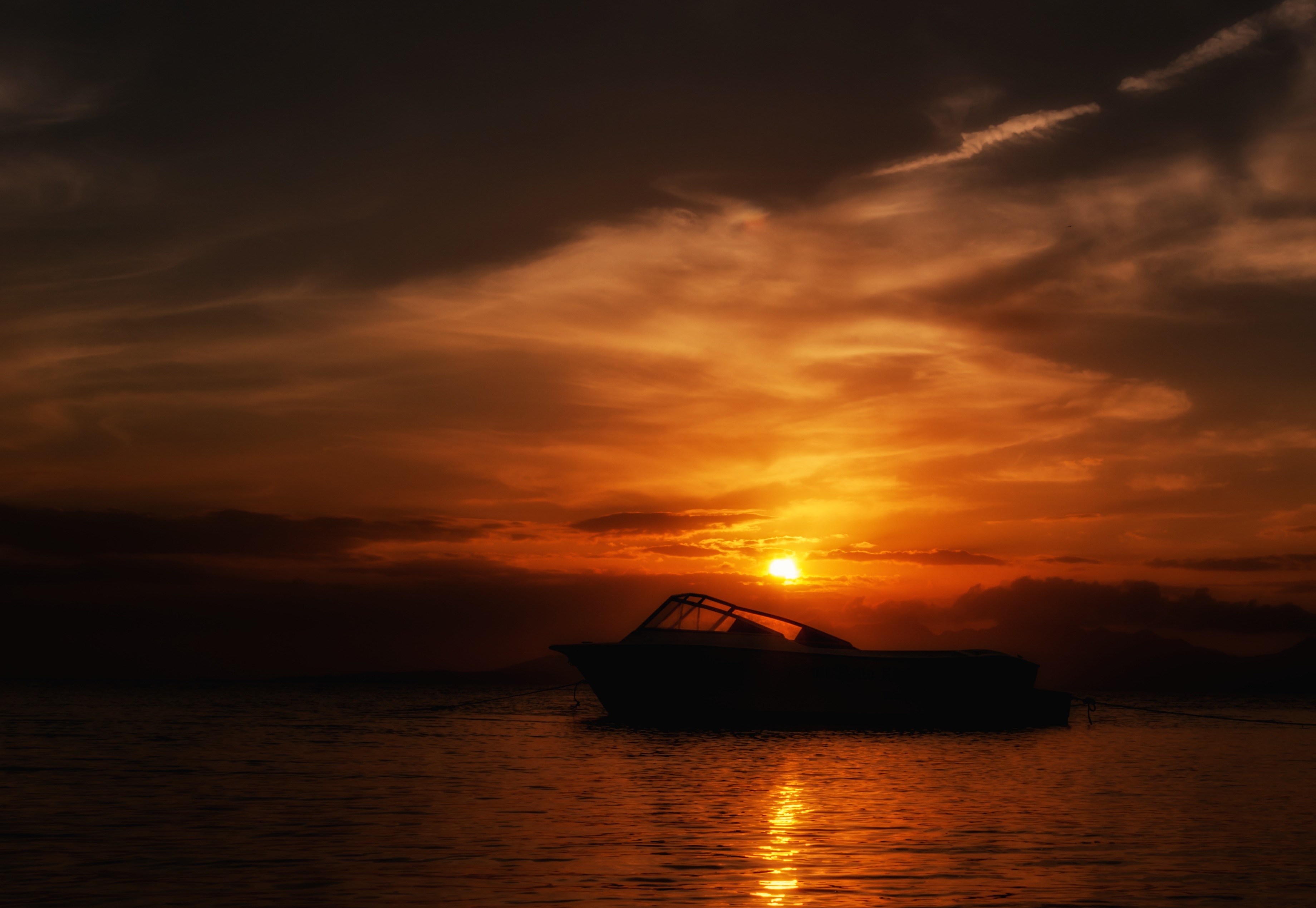 silhouette of speedboat