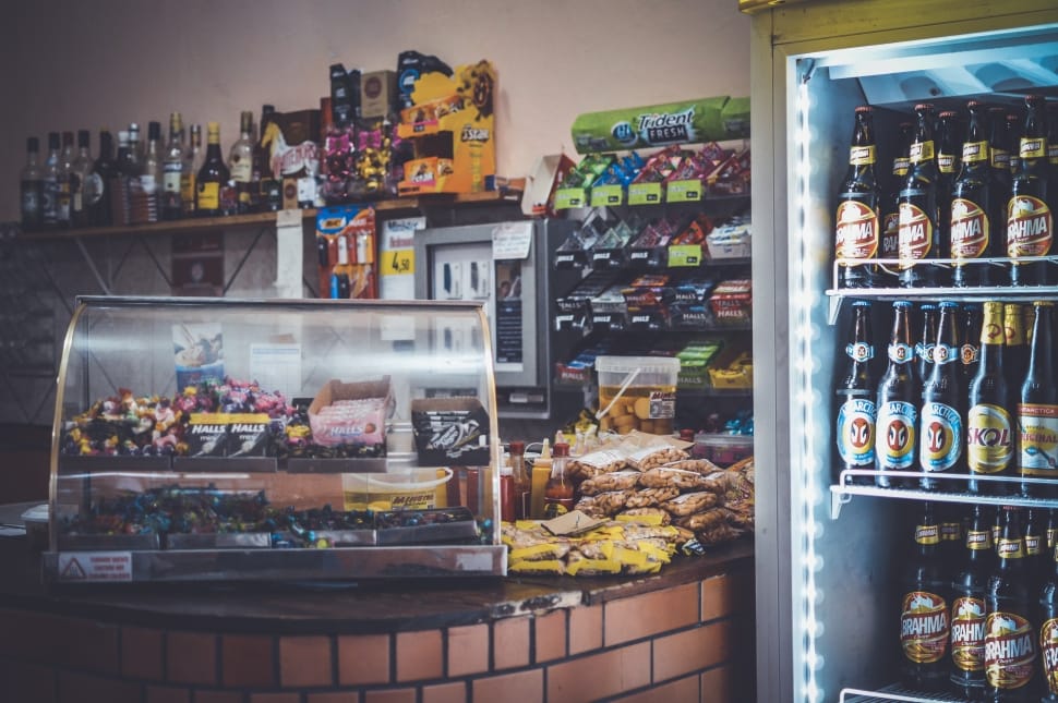 assorted bottles in white commercial refrigerator preview