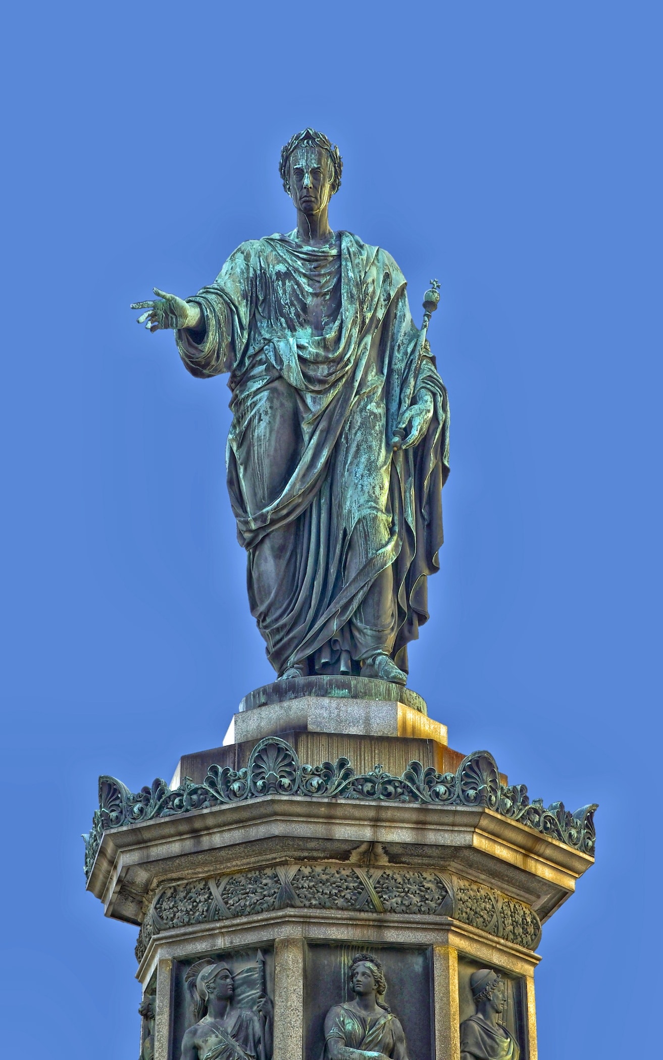 man holding rod statue