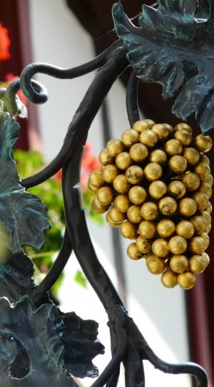 close up photo of gold artificial grape fruit thumbnail