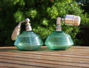 2 green glass and stainless steel spray bottles thumbnail