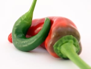 red and green chili on white surface thumbnail