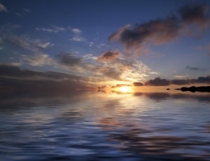 sunrise on the body of ocean photo thumbnail