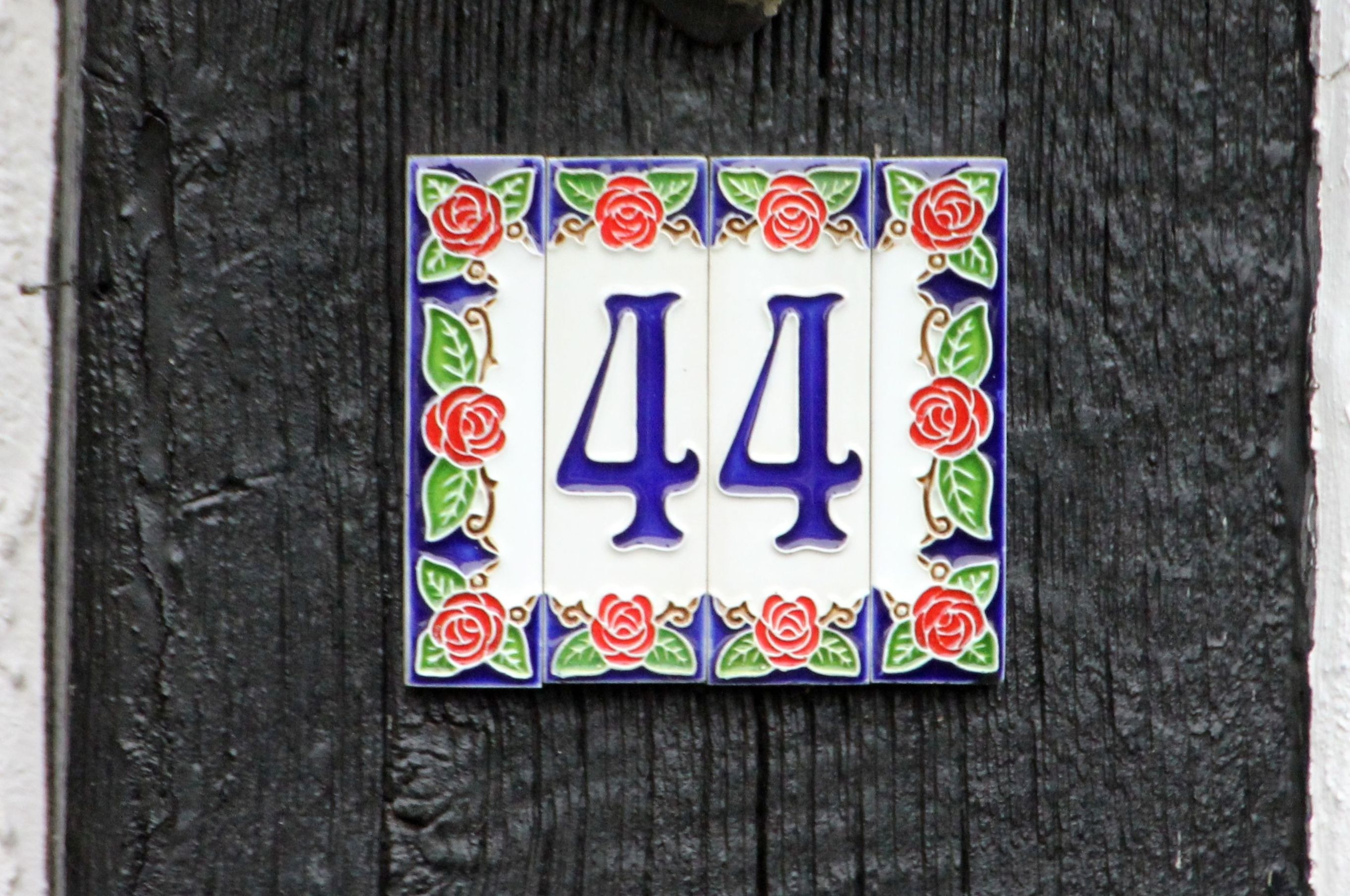 white,red, and blue floral 44 number sign