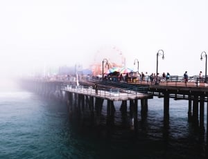 brown wooden dock and yellow ferris wheel thumbnail