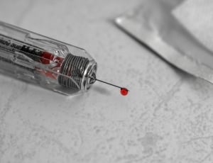 clear syringe with red liquid thumbnail