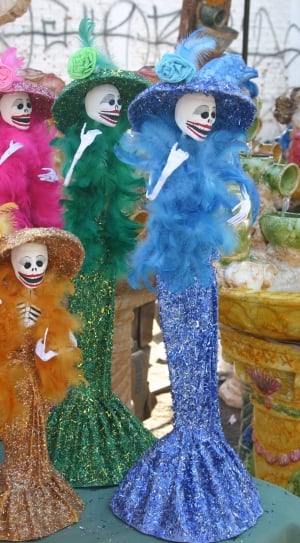 photo of four skeletons glittered dresses thumbnail