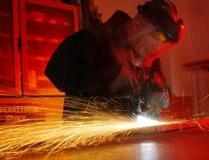 man in black welding suit set holding welding tool thumbnail