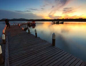 brown wooden dock from body of water thumbnail