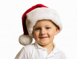 boy's white polo shirt and christmas hat thumbnail