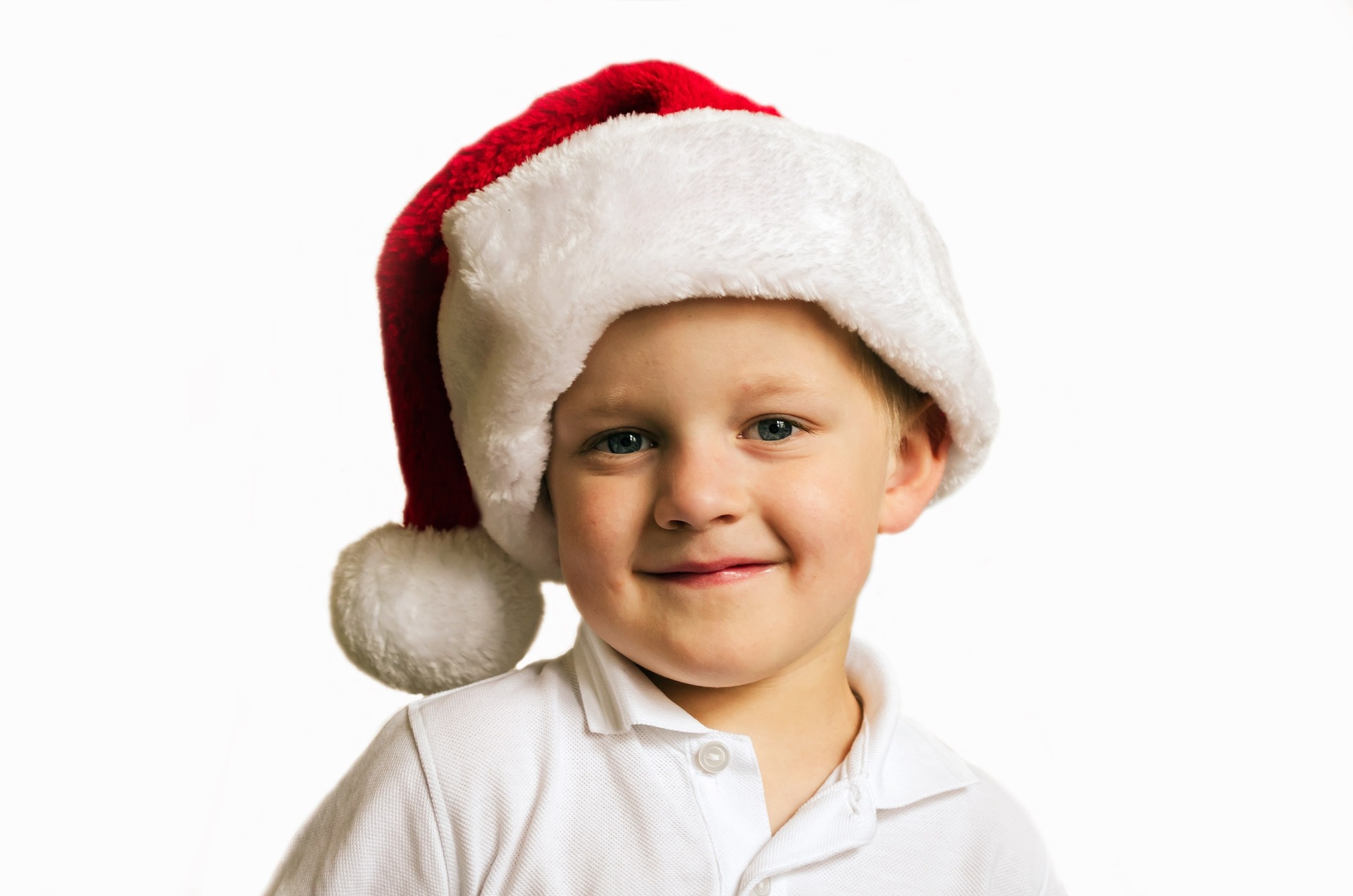 boy's white polo shirt and christmas hat