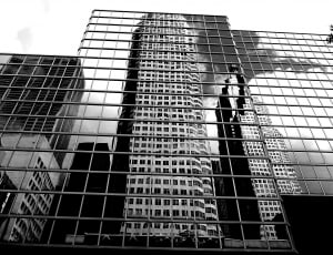 grayscale photography of curtain wall building thumbnail