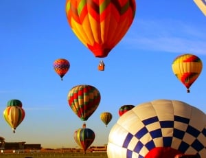 assorted color hot air balloon on mid air thumbnail