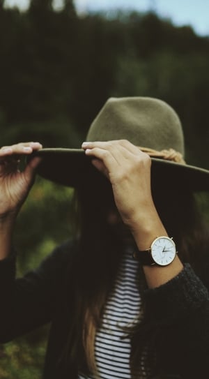 woman with brown hand analog  watch black sweater thumbnail