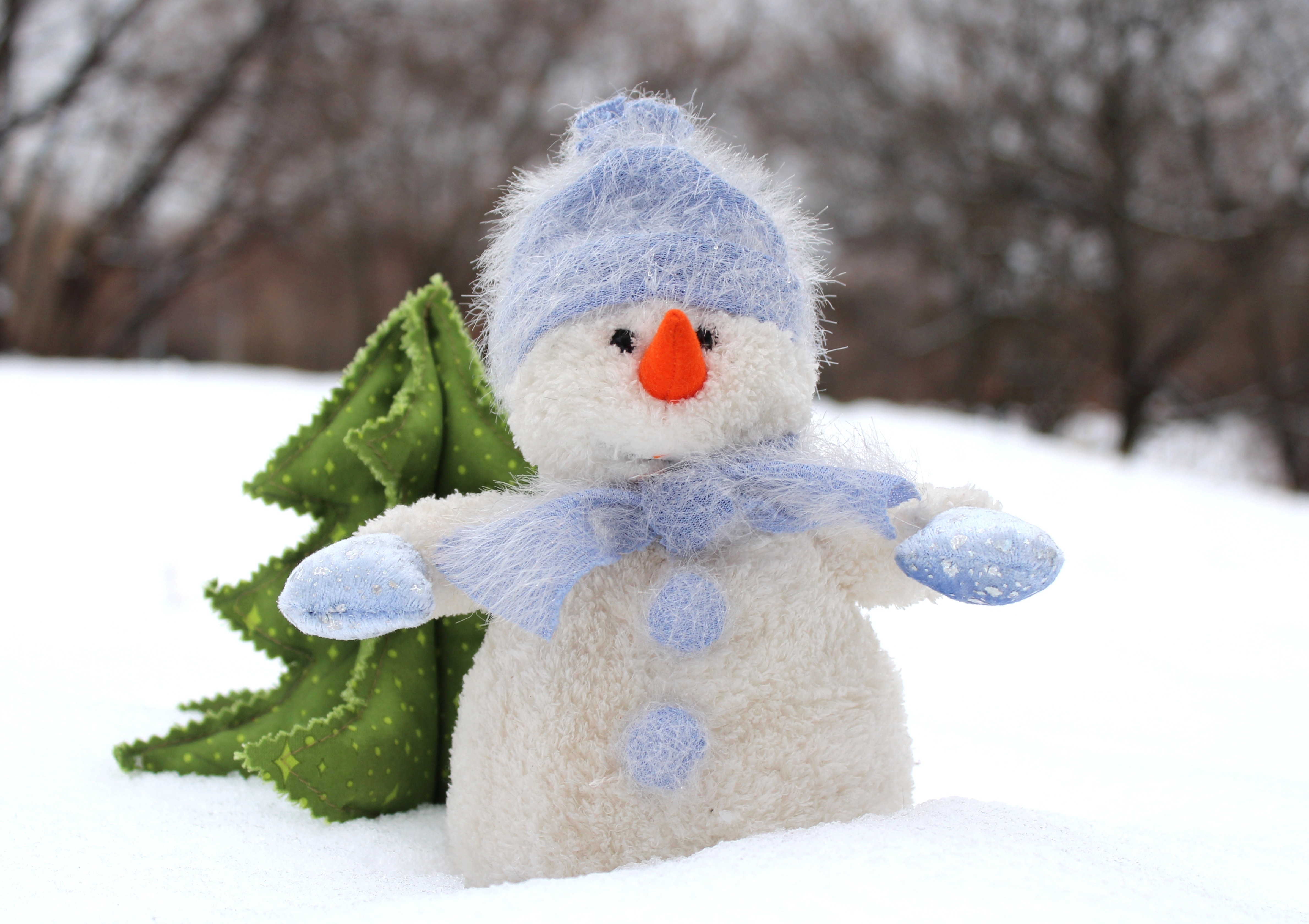 white and blue snowman plus toy