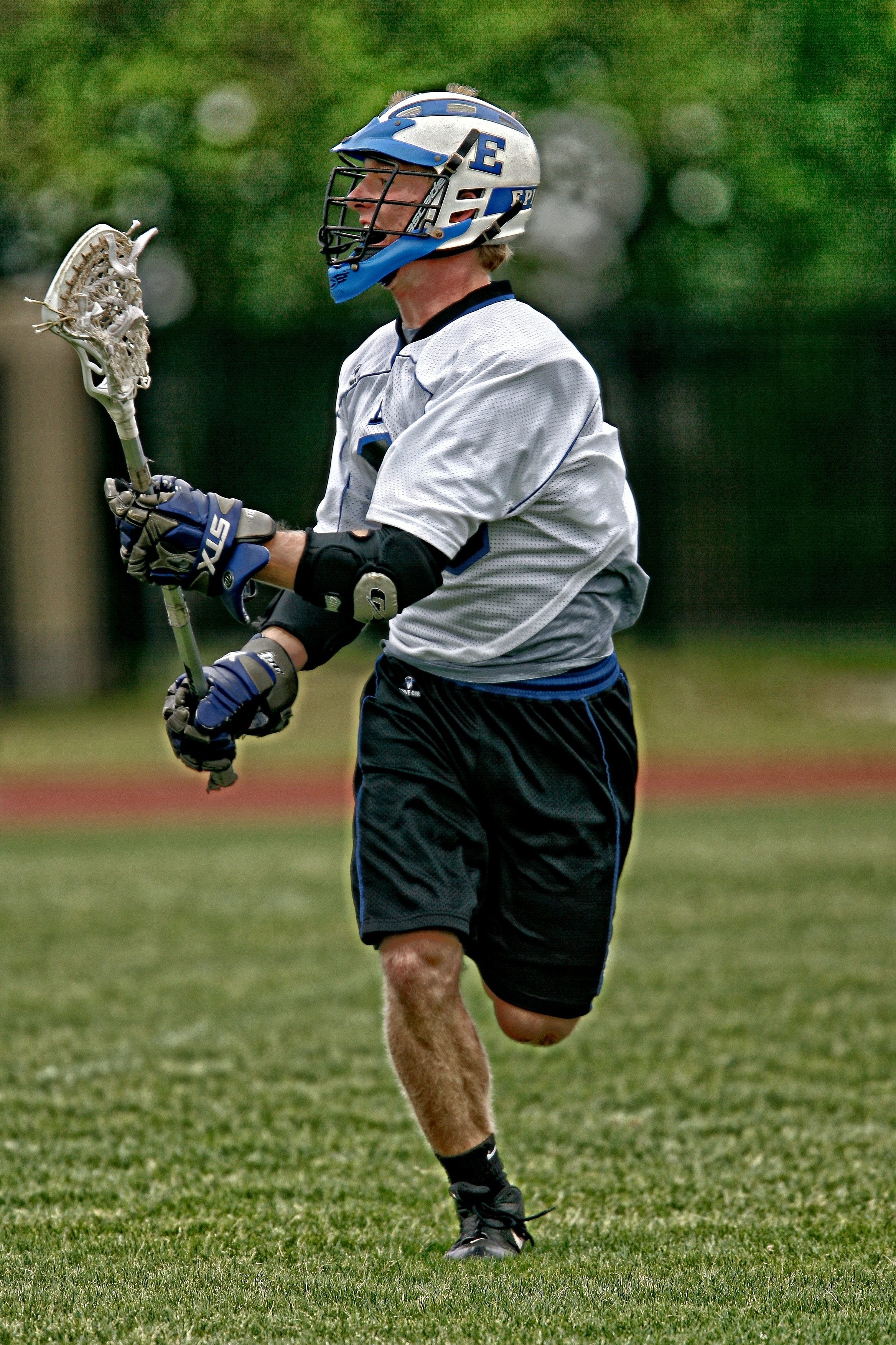 man wearing lacrosse equipment and gear