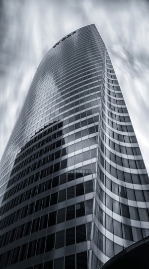 grayscale photo of curtain wall high rise building thumbnail