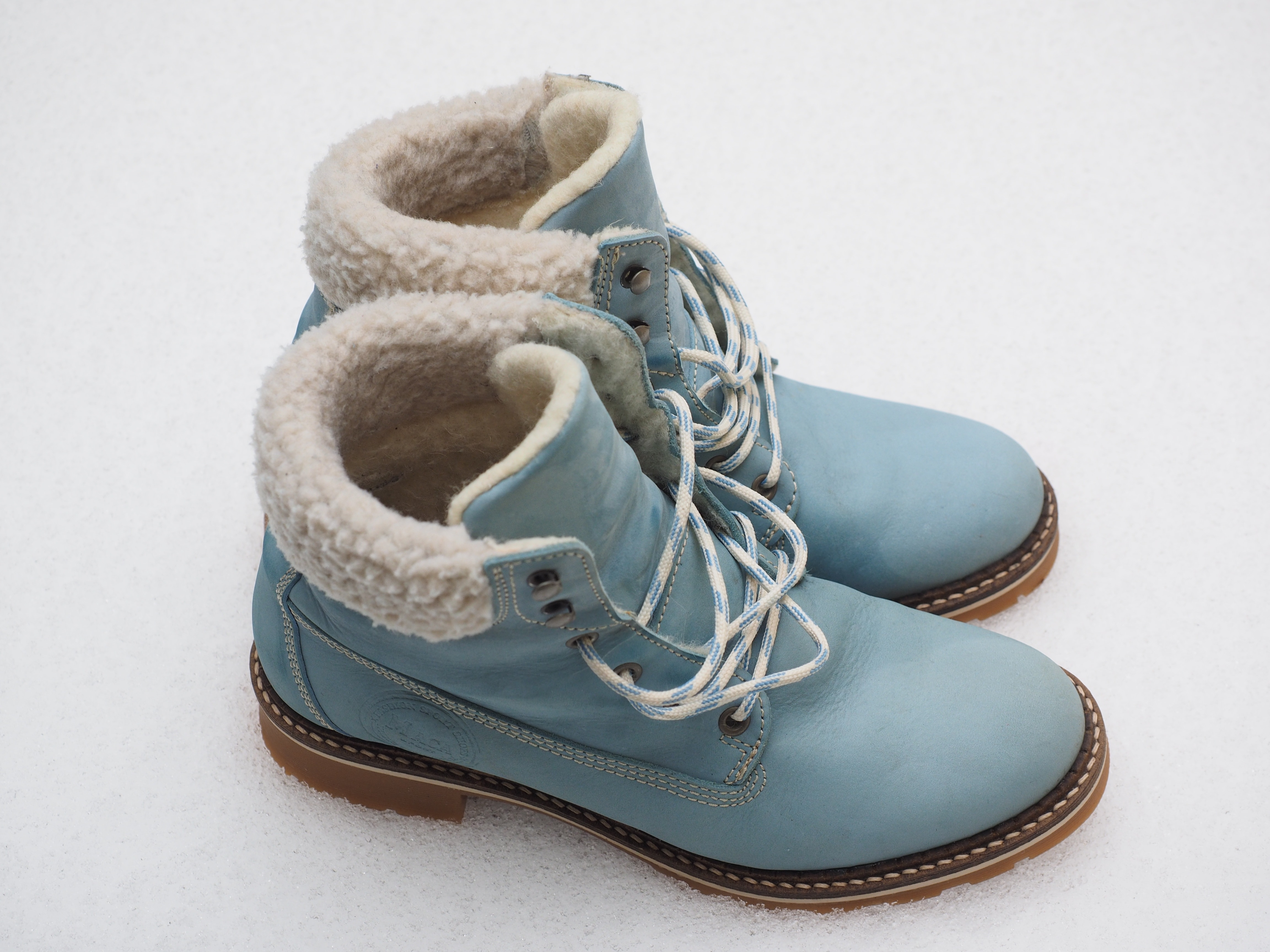 pair of blue leather winter boots