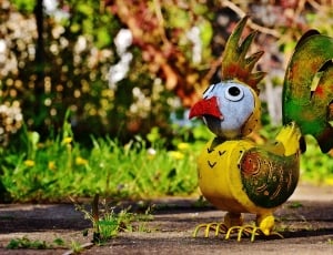 yellow green and white metal bird decor thumbnail