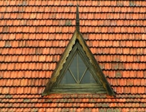 brown wooden framed clear glass triangular attic window thumbnail