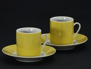 two white ceramic mugs with saucer thumbnail