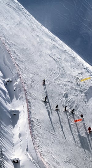 group of people playing ski on snow field in aerial photography thumbnail