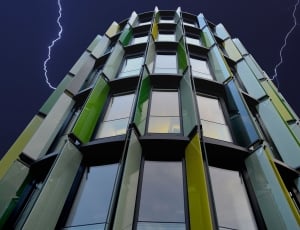 green high rise glass building thumbnail