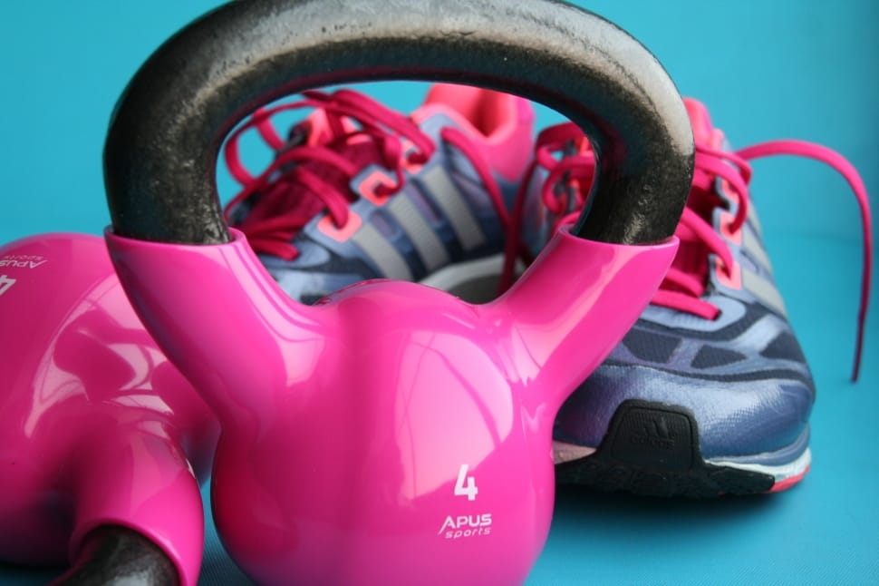 two purple and black 4 lbs. kettle bells and pair of adidas shoes preview